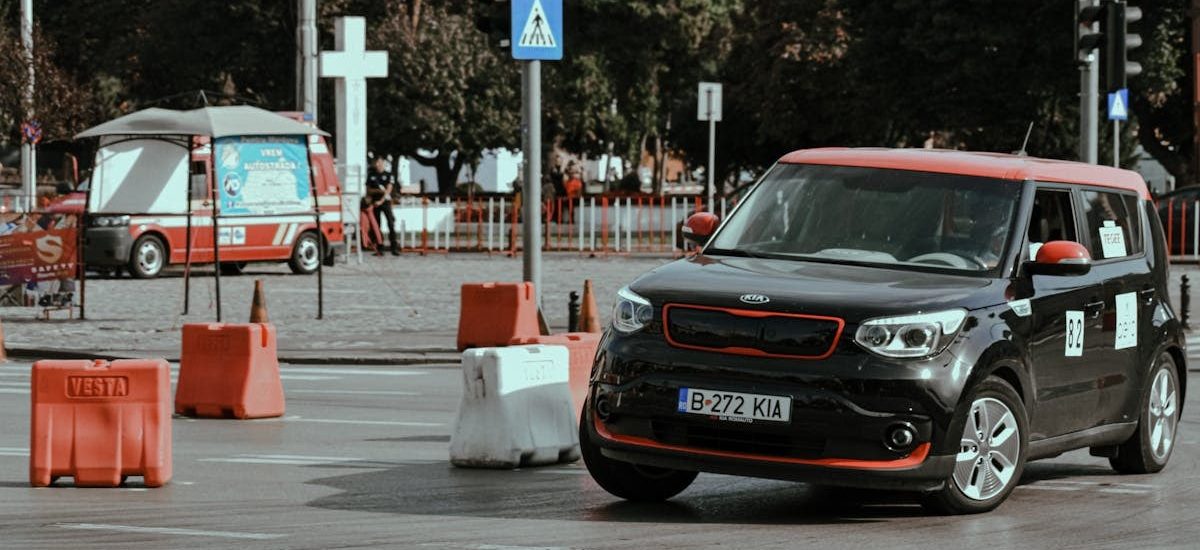 Black car driving fast and turning in drift while taking part in urban rally racing